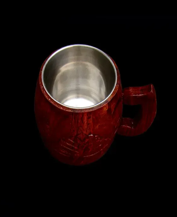 this is the beautiful and best handmade wooden coffee mug with stainless steel inside. It is handcrafted by the best artisans and engraved by hand. By the best handcrafted wooden coffee mug on www.agrrro.com.