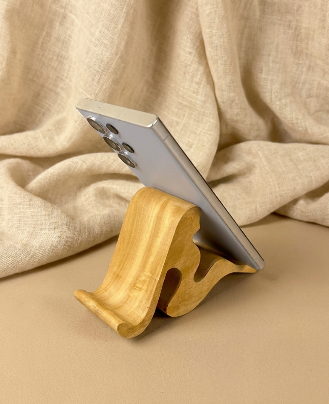 A handcrafted abstract wooden sculpture celebrating feminine form through smooth curves and minimalist design.