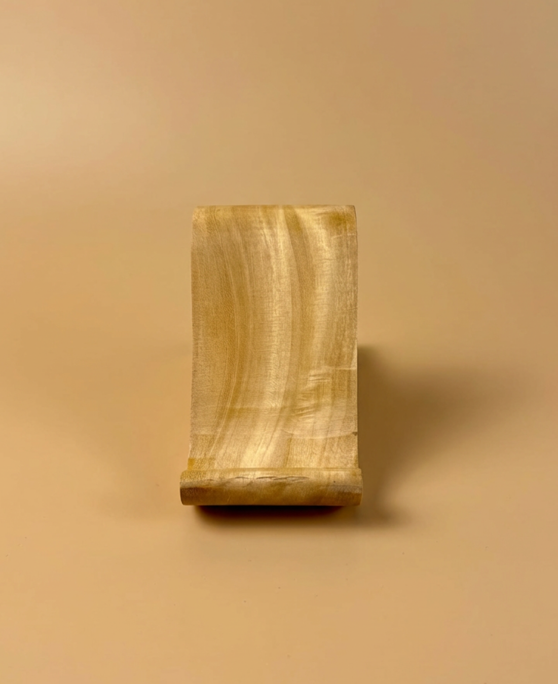 A handcrafted abstract wooden sculpture celebrating feminine form through smooth curves and minimalist design.