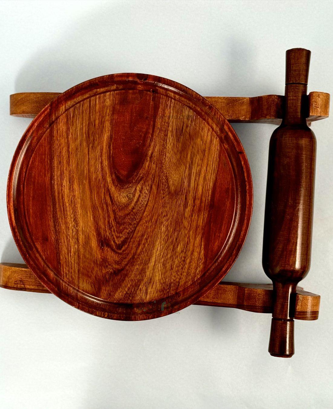Side angle view of chakla belan set showing elegant curves, deep wood tones, and natural texture on white background.